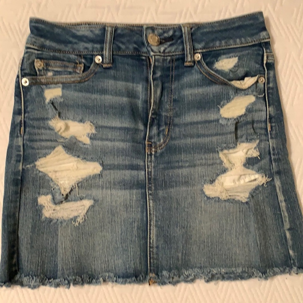 Distressed jean mini skirt